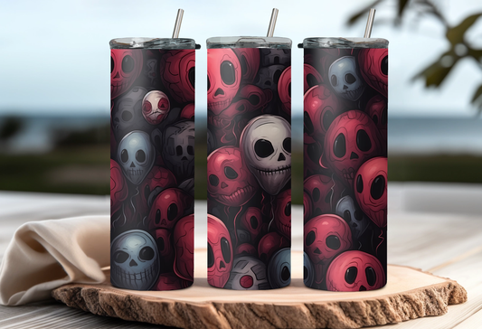Three tumblers with skull pattern on a wooden board